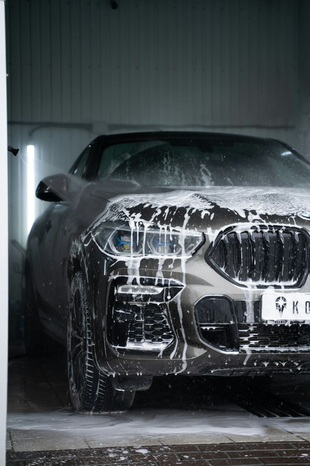 Car covered in foam during a wash