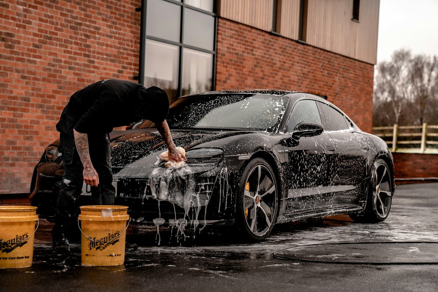 Water splashing off a freshly detailed black car